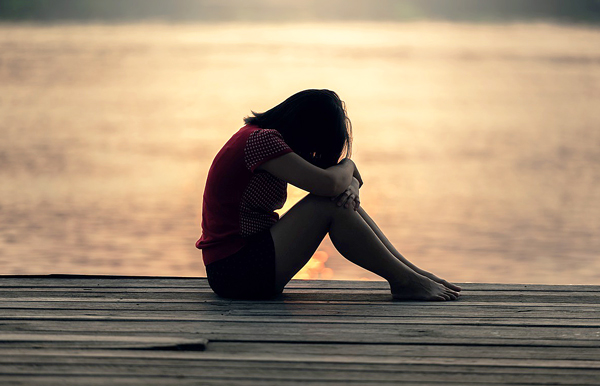 girl on pier alone